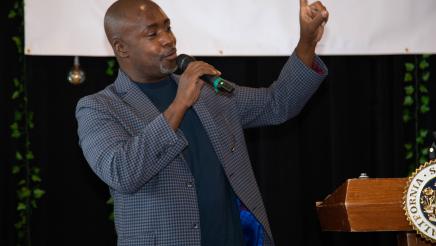 Guest speaker holding microphone