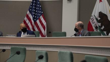 Asm. Bryan converses with a committee member