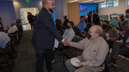 Asm. Bryan greeting a constituent