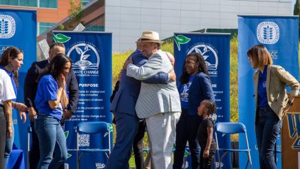 Asm. Bryan hugging guest speaker