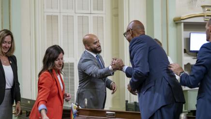 Asm. Bryan being congratulated by Asm. Holden on the Assembly Floor