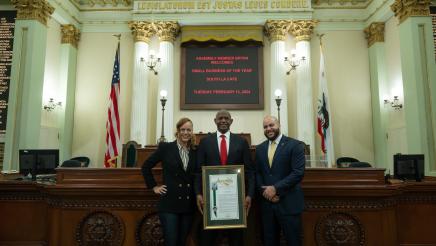 Asm. Bryan precenting Assembly resolution to owners of South LA Cafe