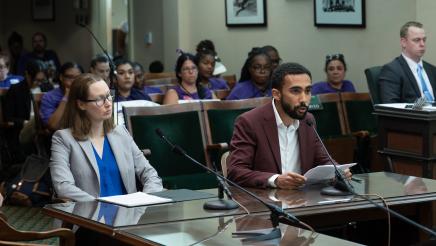 Witness providing testimony while another witness listens on