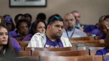 Audience members listening on intently
