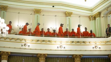 Incarcerated firefighters seated in balcony