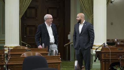 Asm. Bryan and Dr. Slavin conversing on the Assembly Floor