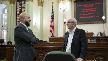 Asm. Bryan and Dr. Slavin conversing on the Assembly Floor