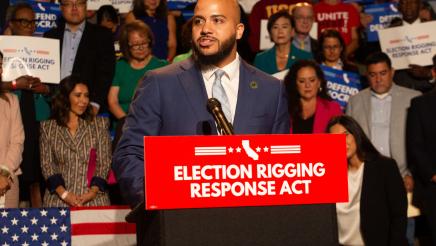 Asm. Bryan at podium, speaking