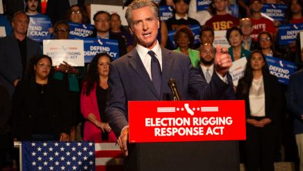 Gov. Newsom speaking as Asm. Bryan and others stand in support